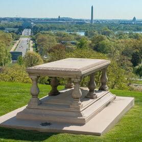 Picture of Pierre Charles L'Enfant Gravesite above ground sitting on a hill with a view of Washington DC including the Washington Monument in the background