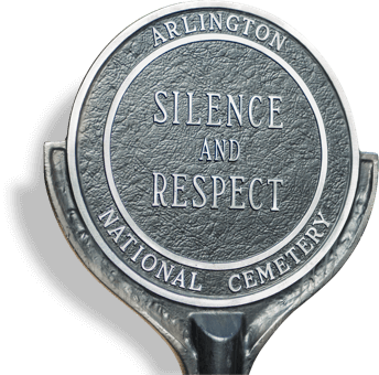 silhouette of a marker that reads 'Arlington National Cemetery Silence and Respect'