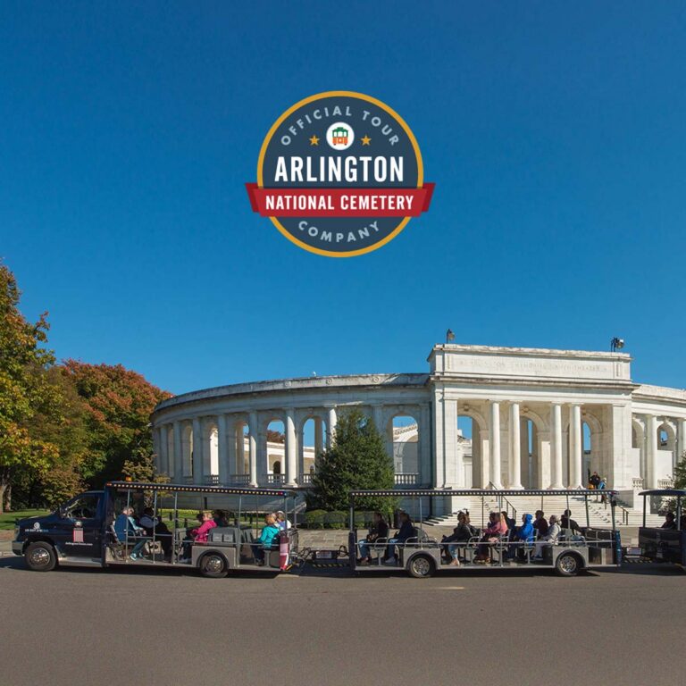 Arlington Tours vehicle driving past cemetery amphitheater and official tour company seal