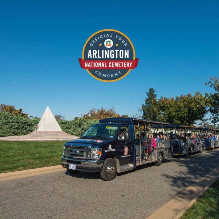 Arlington Tours vehicle driving past US Coast Guard Memorial and official tour company seal